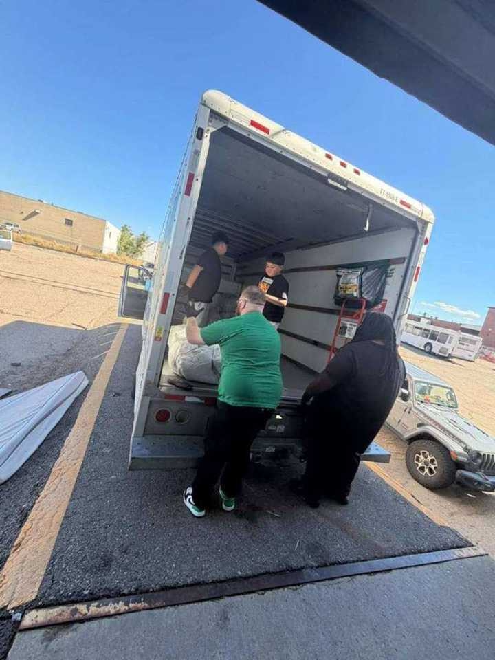 Volunteers unloading blankets